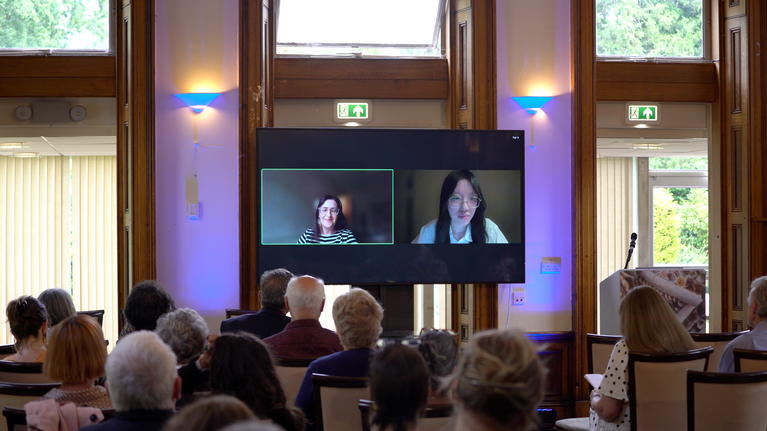 Wenyu Dong presenting a paper at the A la Ronde Symposium